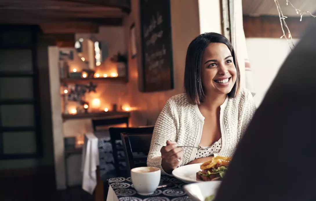 Young woman enjoying lunch in a restaurant