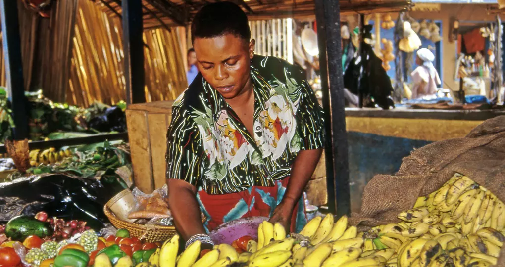 A vendor in the markets of Kampala A vendor in the markets of Kampala