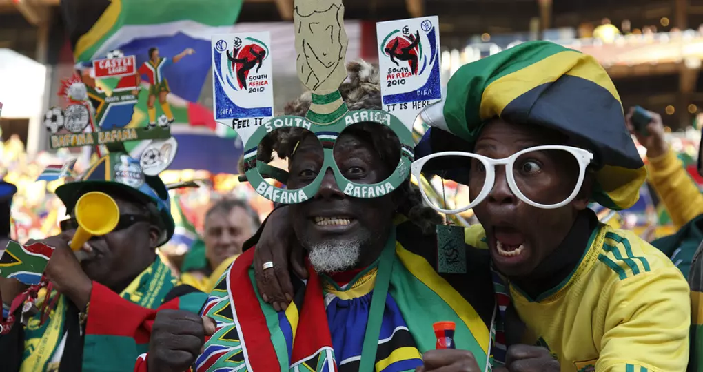 Supporters cheering on their teams