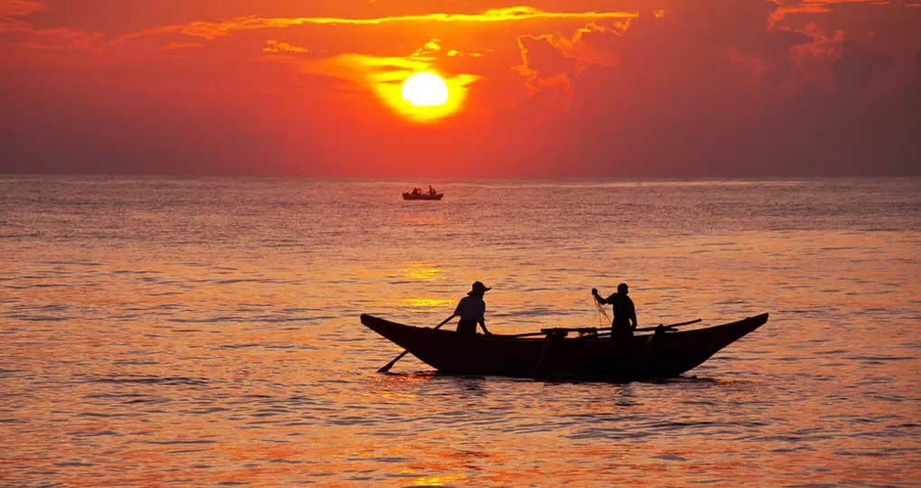 A fishing boat at sunset