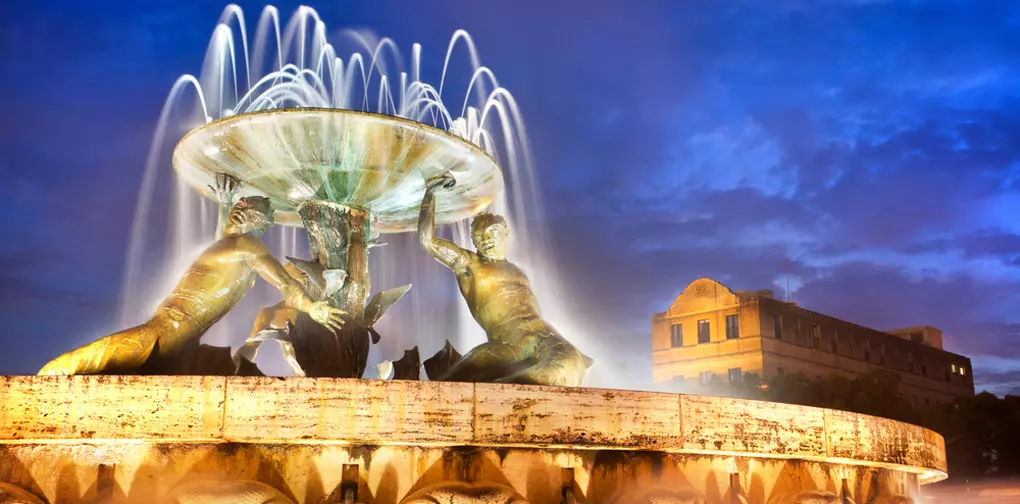The Triton Fountain - always a popular photo stop on all Malta vacations.