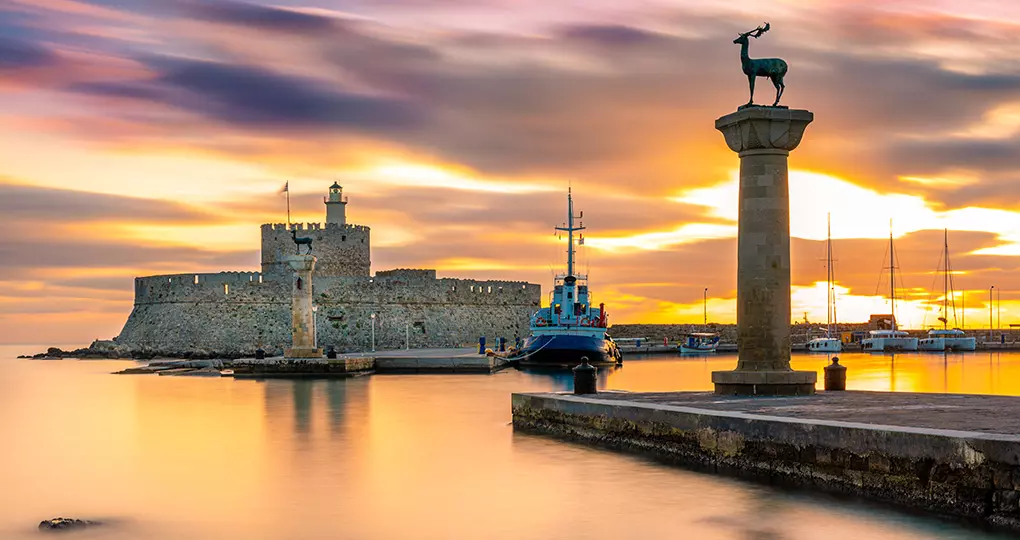 Stroll the waterfront at Mandraki Harbour, believed to be the site of the great statue of Colossus, one of the Seven Wonders of the Ancient World Stroll the waterfront at Mandraki Harbour, believed to be the site of the great statue of Colossus, one of the Seven Wonders of the Ancient World