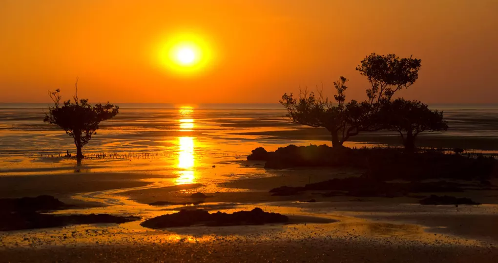 Sunset over mudflats and mangroves in Kakadu Sunset over mudflats and mangroves in Kakadu
