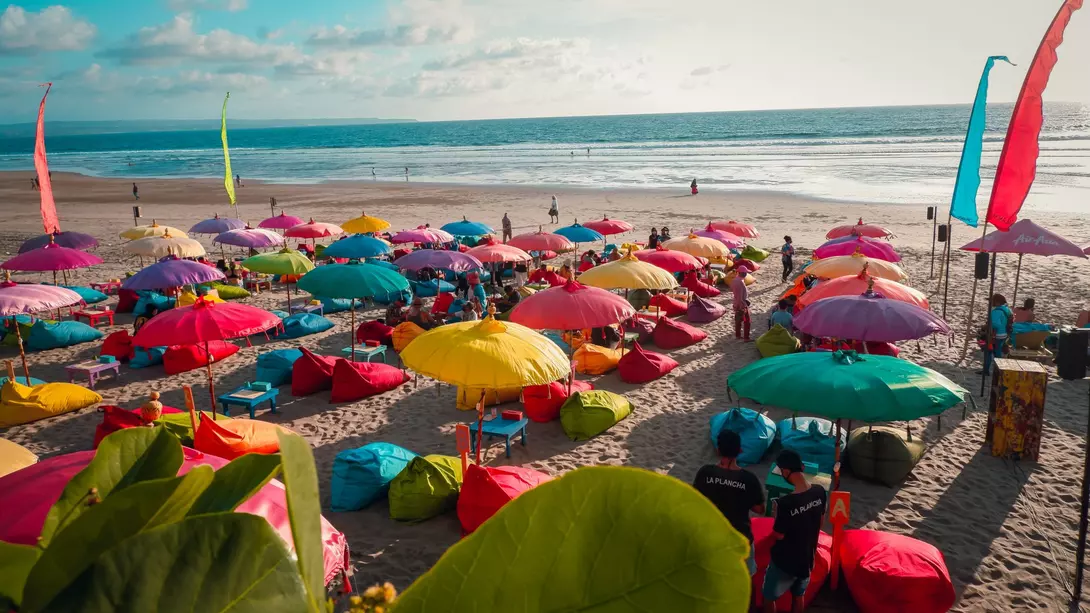 Double Six Beach Colourful beach umbrellas with view of Double Six Beach, Seminyak, Bali, Indonesia