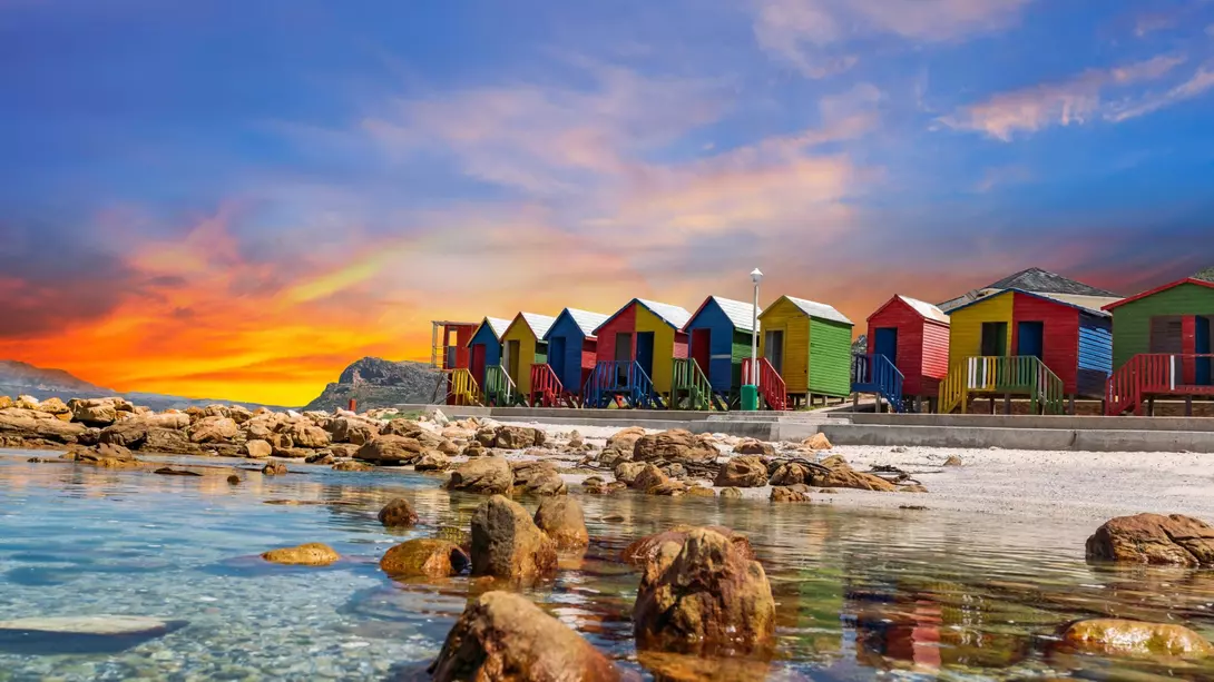Muizenberg beach huts wooden cabins at twilight in Cape Town South Africa
