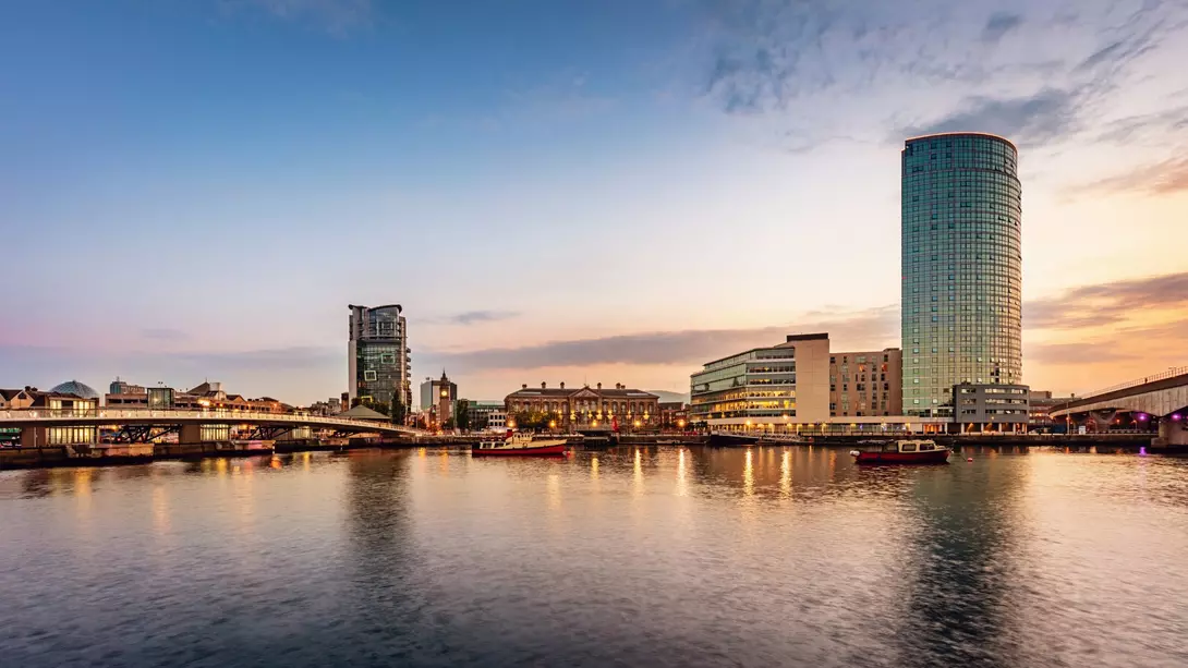 Panorama of Belfast River Lagan Waterfront Cityscape and Lagan Bridge at Sunset Twilight