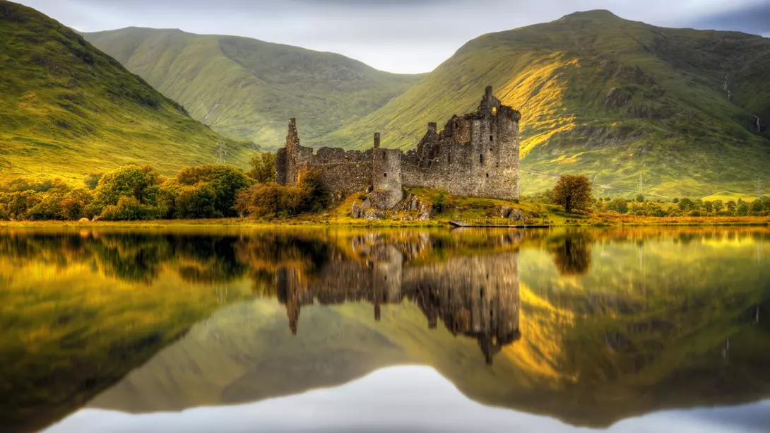 Reflections in Loch Awe at sunset of Kilchurn Castle, Scotland