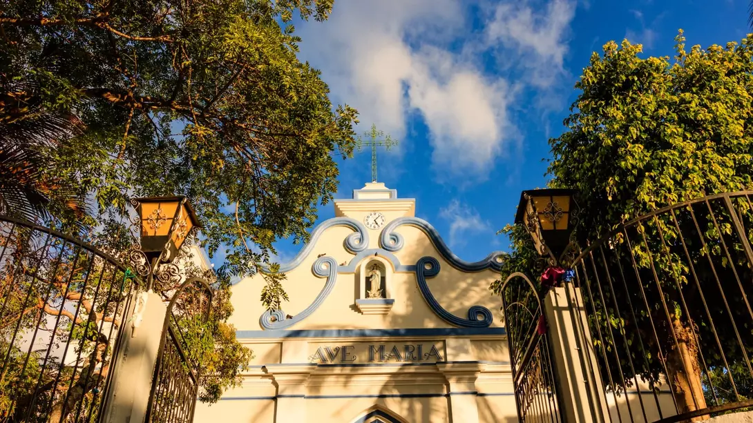 Sun shining over a small village colonial cathedral in El Salvador, Central America