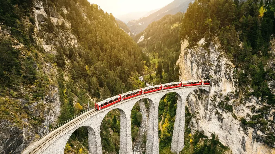 Train crossing Landwasser Viaduct on rhaetian railway in Filisur – Albula, Graubunden, Switzerland
