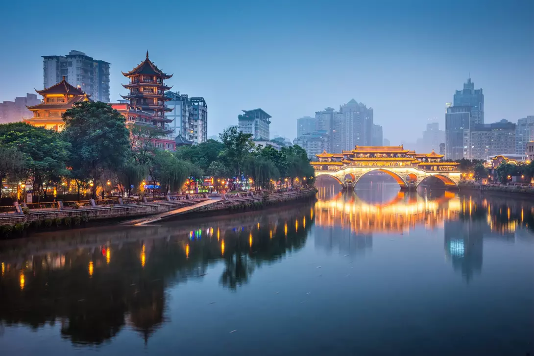 river with bridge and pagoda in background