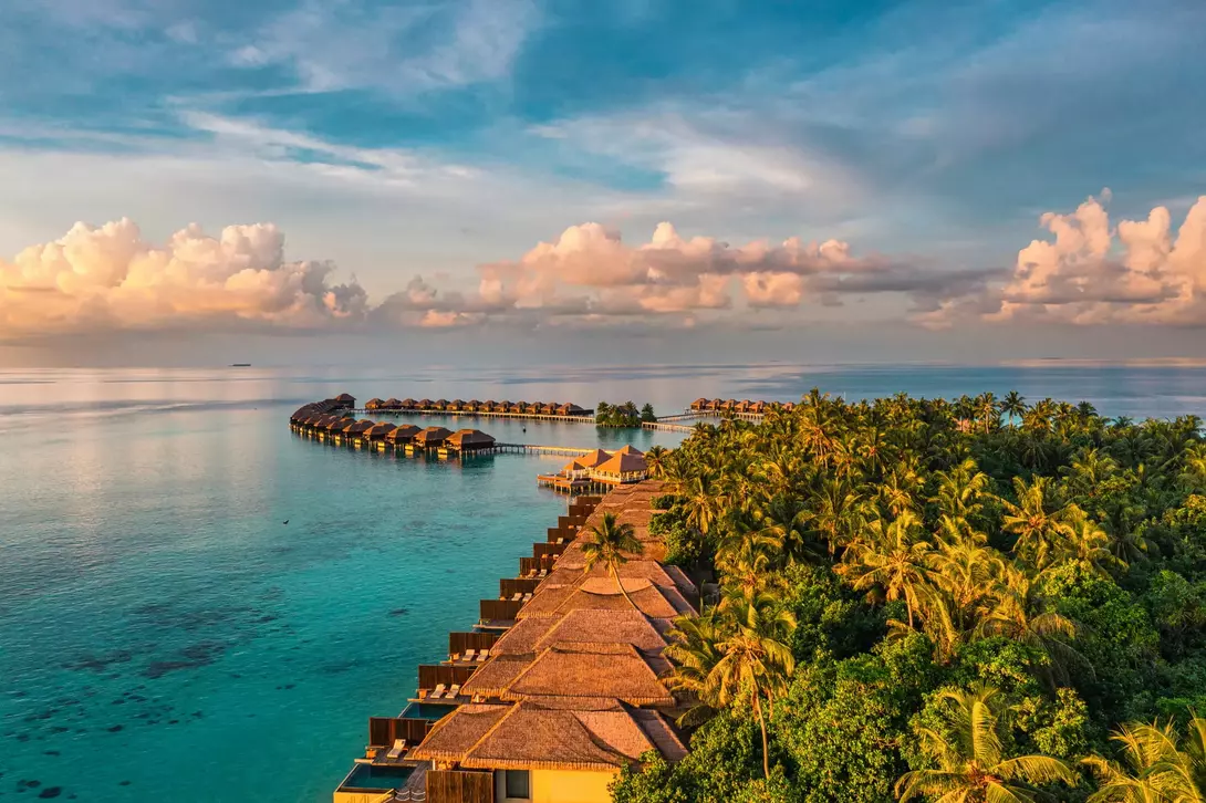 Aerial view of bungalows over the ocean in the Maldives