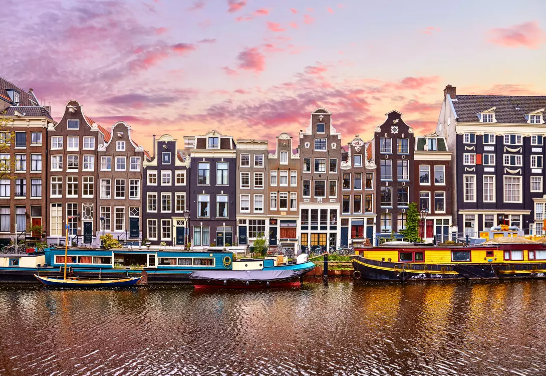 Floating Houses and houseboats and boats at channels by banks