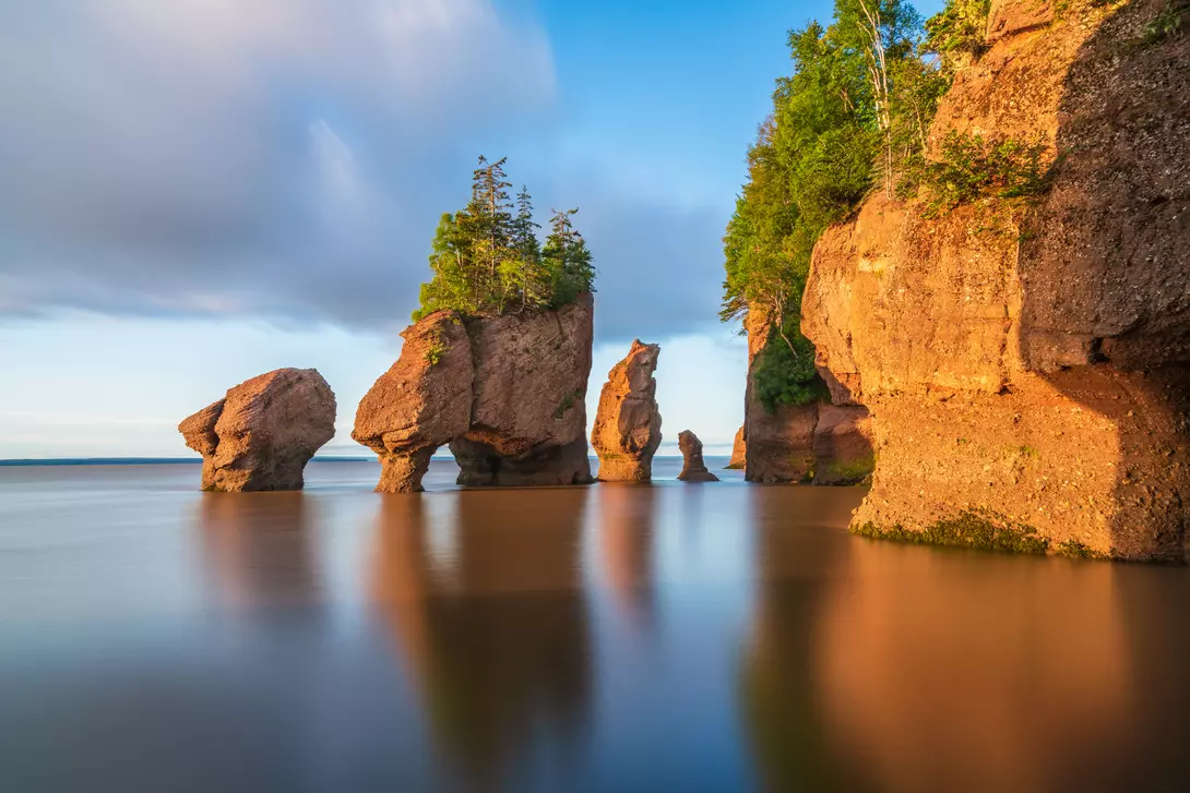 Hopewill Rock at sunrise during high tide in the Bay of Fundy