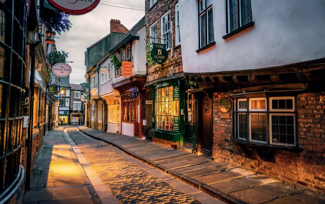 The Shambles, a medieval street preserved in the heart of the English city of York, still busy with boutique shops and cafes