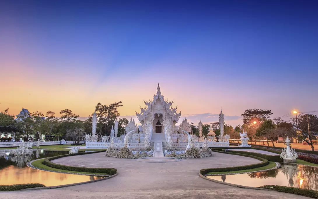 Evening view of Wat Rong Khun or White Temple in Chiang Rai, Thailand