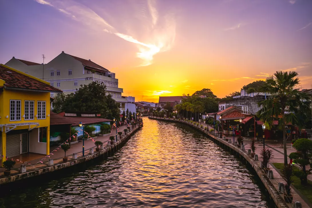 Melaka Tengah District River canal and the old town in Melaka, or Malacca, Malaysia at dusk