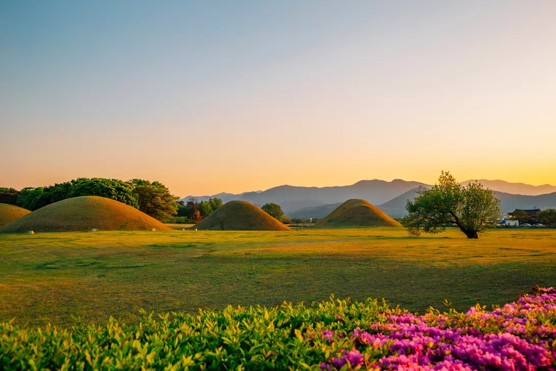 Sunset view of Gyeongju Daereungwon Tomb Complex grass mounds in Gyeongju, Korea