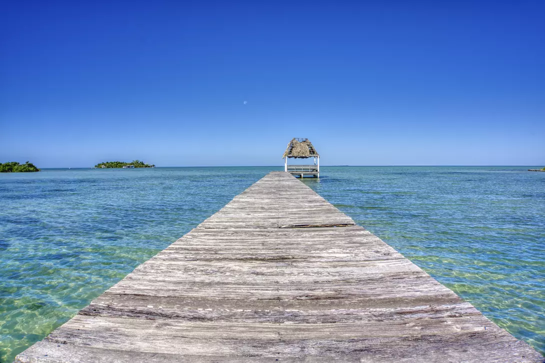 Pier over the blue sea on San Pedro Island in the Caribbean nation of Belize