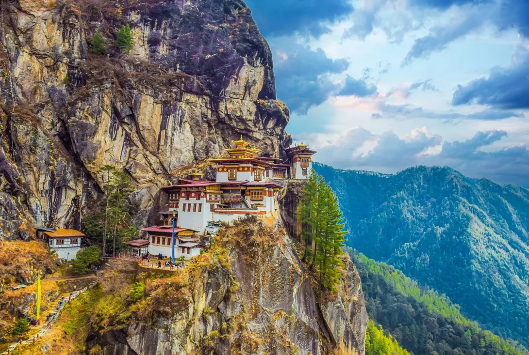 The Taktsang Palphug (Tiger’s Nest) monastery clings to cliffs 1200m above the forested Paro Valley