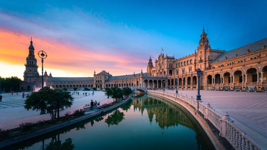 Plaza de España, Sevilla, Andalusia Famous plaza with Dramatic Colorful Clouds at Sunset,