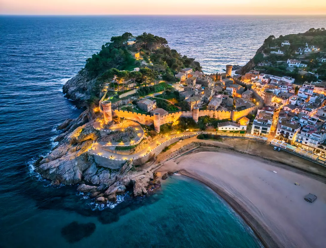 Aerial view of walls of Tossa de Mar in Costa Brava, Catalonia,at sunset, Spain
