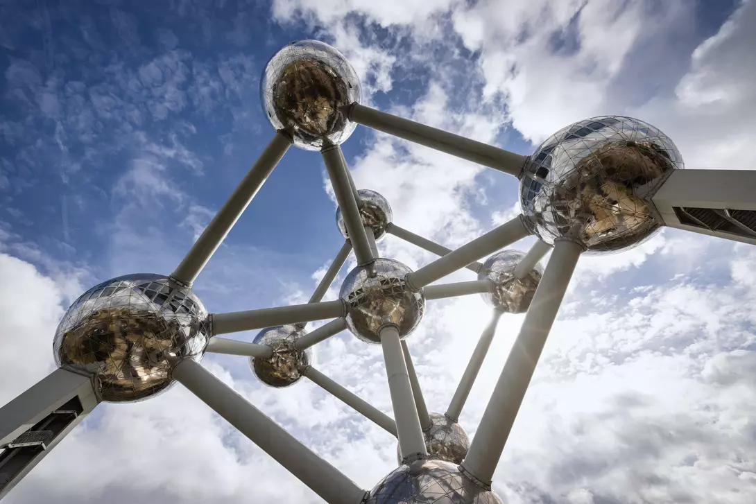 The Brussels Atomium Monument from below under blue summer sky.