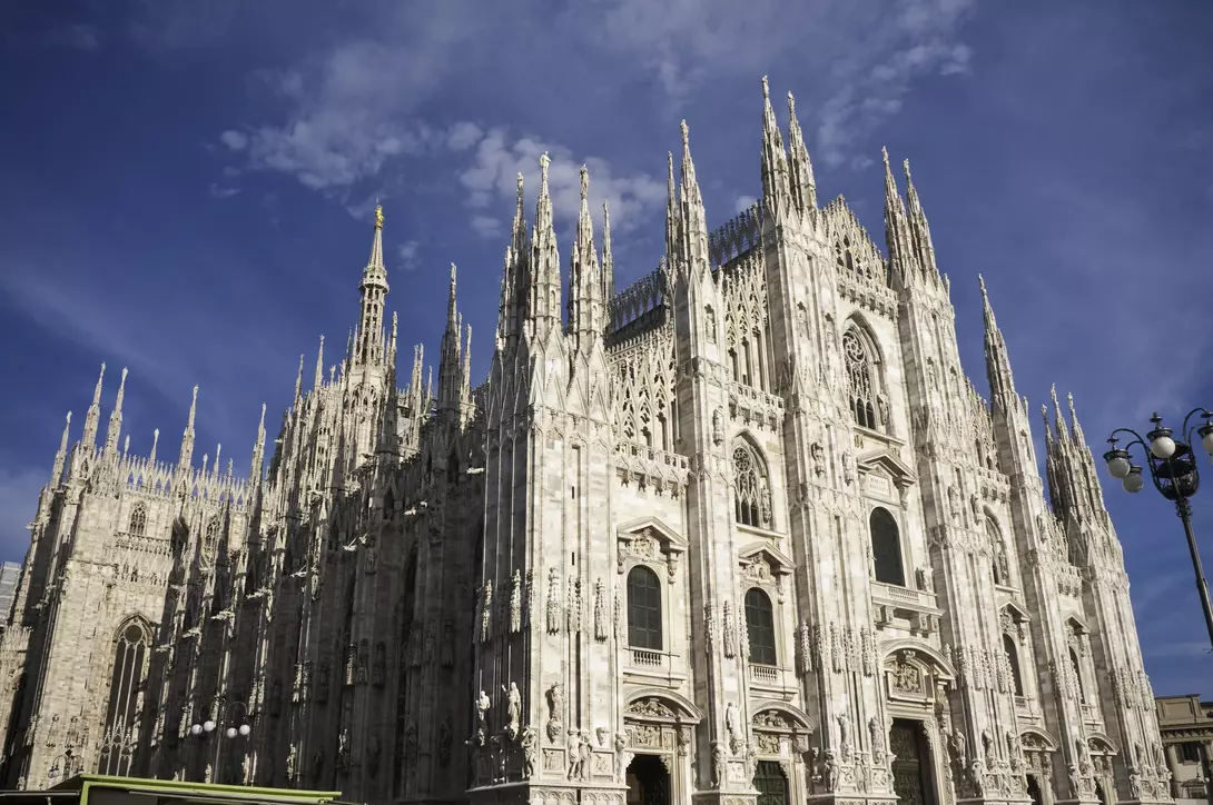 The ornate gothic facade, soaring spires and magnificent marble towers of the Duomo