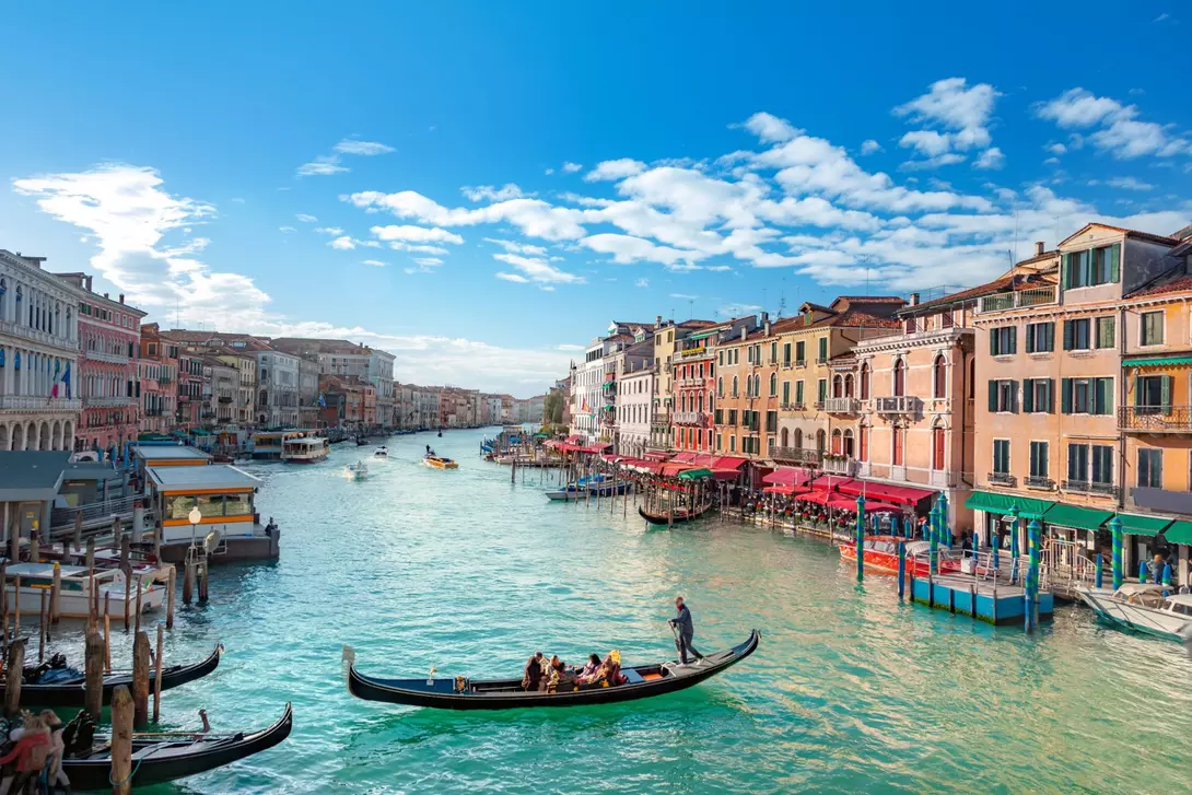 Boats drift in the Venice Grand Canal