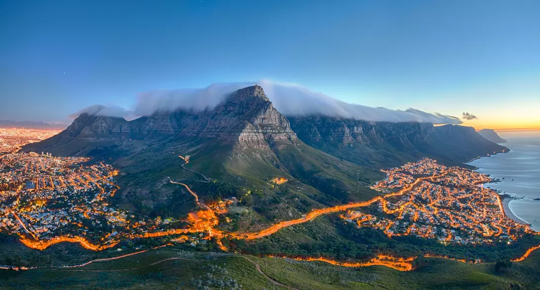Table Mountain covered by its typical cloud table cloth and the twelve Apostles