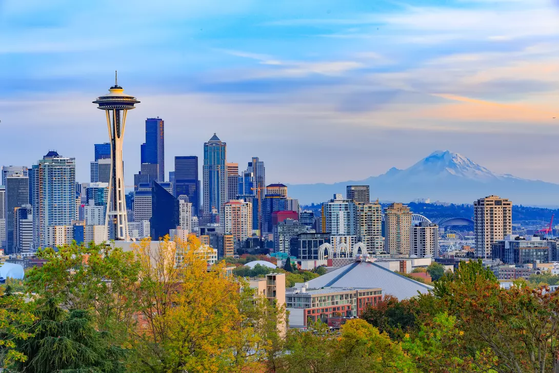 City skyline featuring the space needle with Mount Rainier in the background
