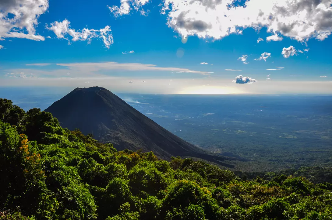 View of volcano with lush hungles and horizon