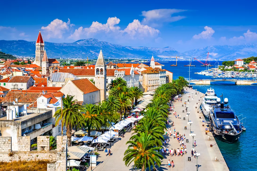 Sunny promenade along the pier of old Venetian town, Dalmatian Coast.