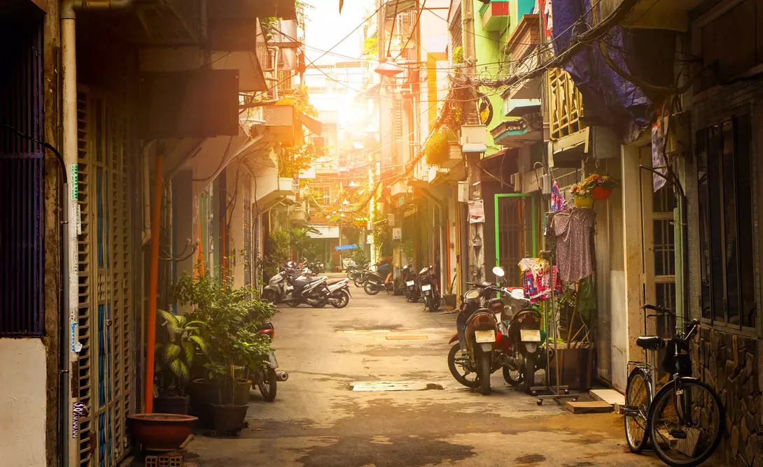 Motor bikes lined down narrow street of Ho Chi Minh city, Vietnam