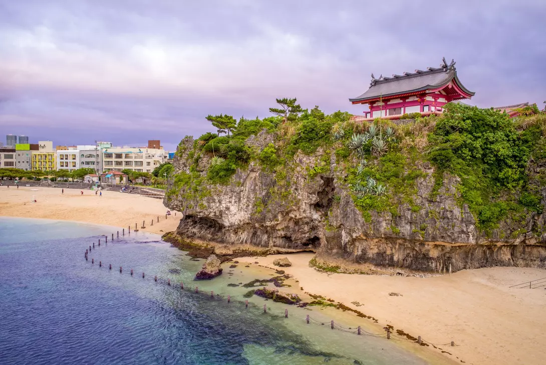 Japanese shrine on hill over breach and ocean