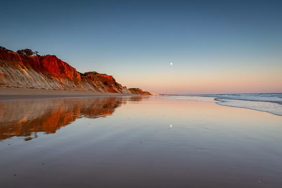 Wander the reflective shores of Albufeira