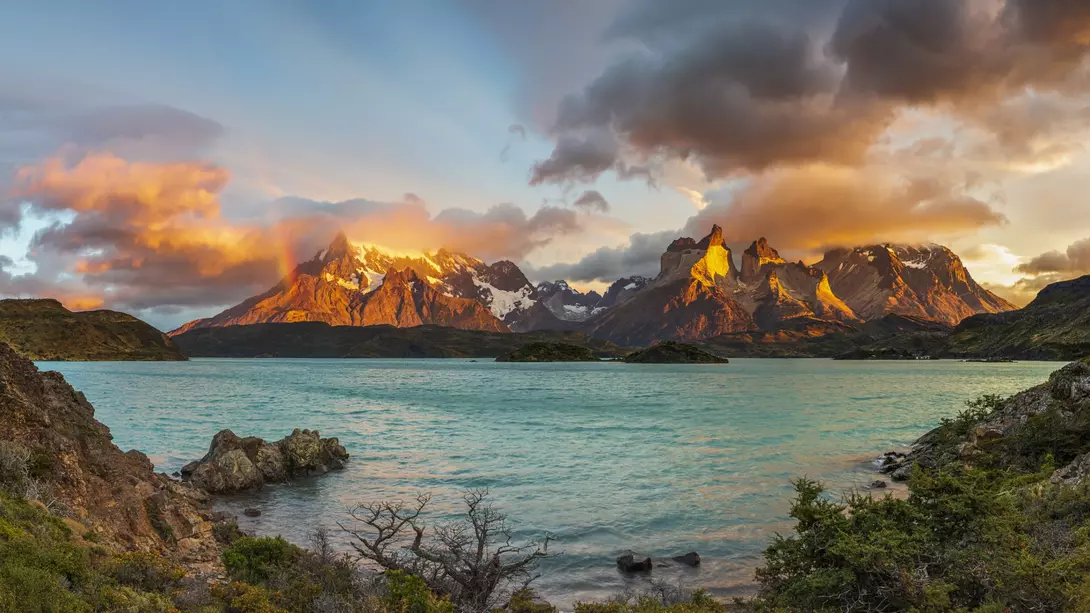 Sunrise with Rainbow in the Patagonian Andes Mountains