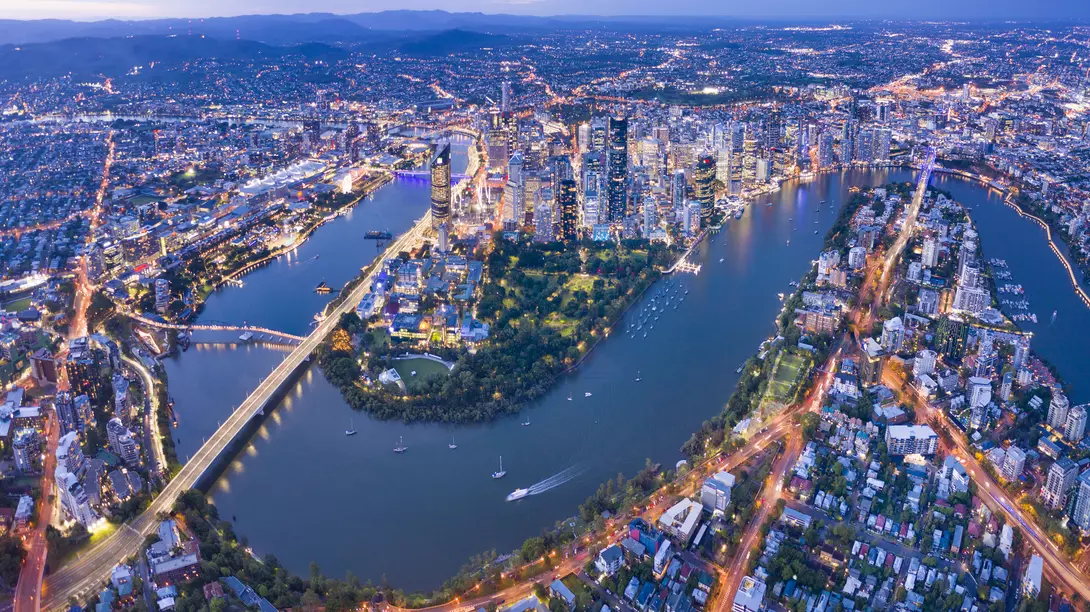 Brisbane Skyline Night Panorama with the famous illuminated Story Bridge, Botanical Garden and Whell, Queensland, Australia.