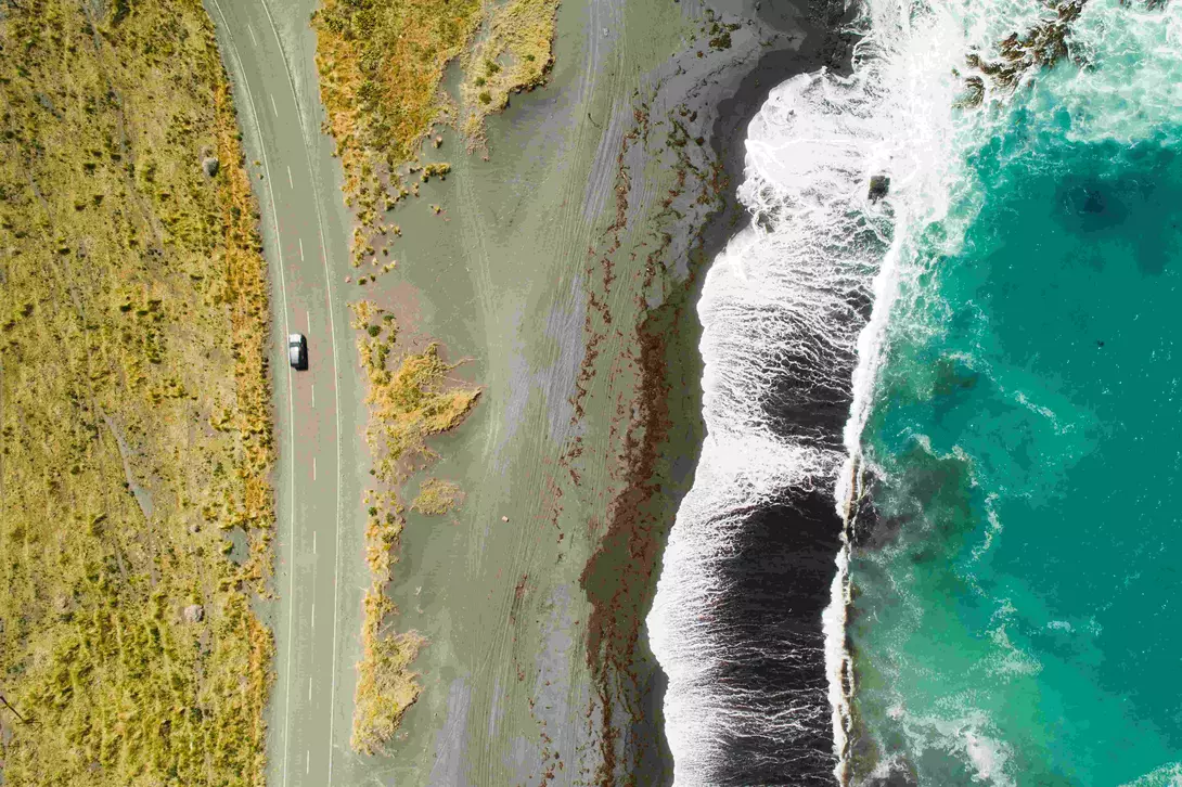 Top view of sea, waves and road in Wairarapa Region