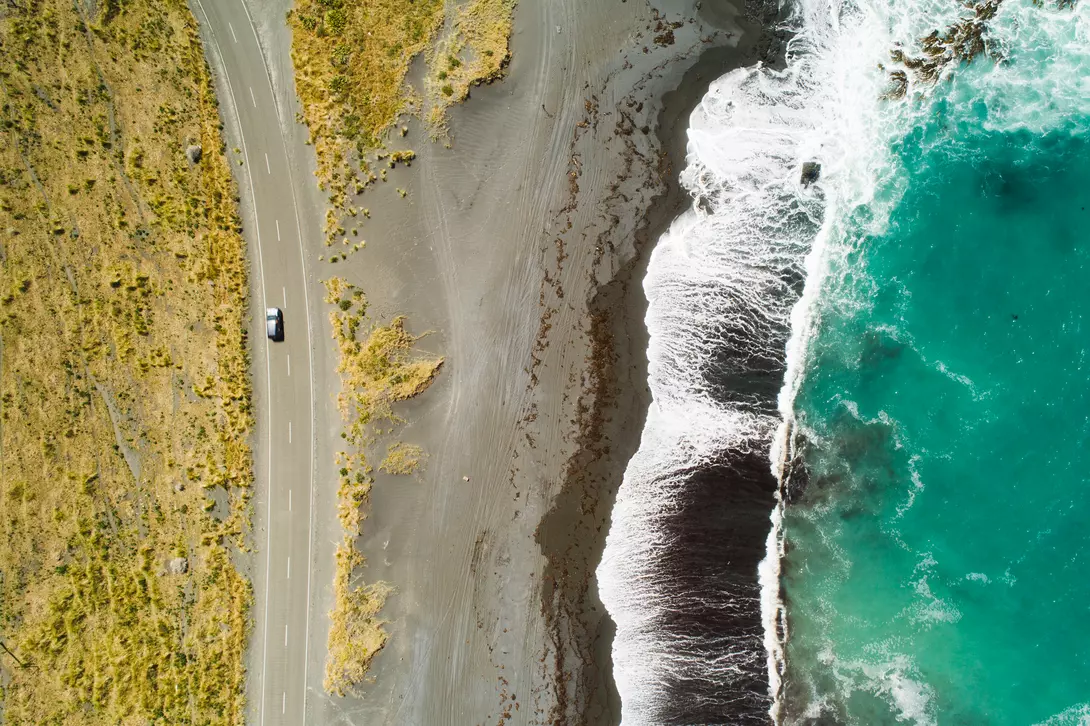 Top view of sea, waves and road in Wairarapa Region