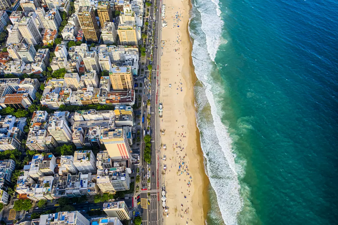 Ipanema district, strip of sand with people enjoying the beach and the ocean