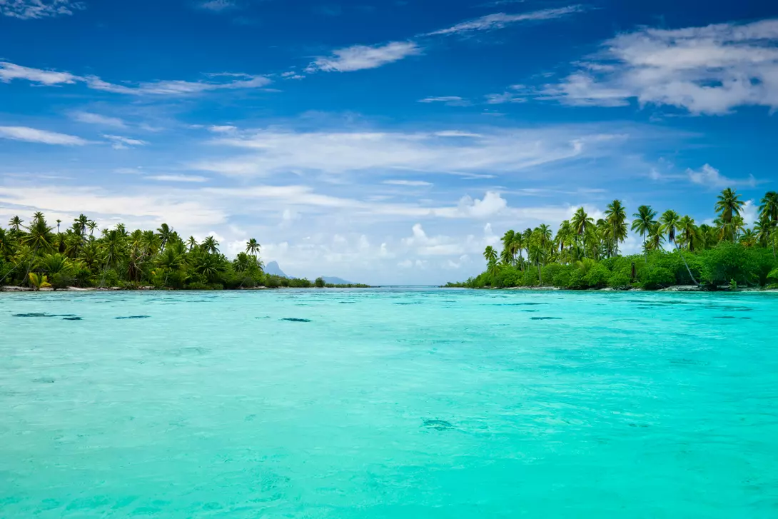 View over beautiful turquoise lagoon with small and lonesome islands.