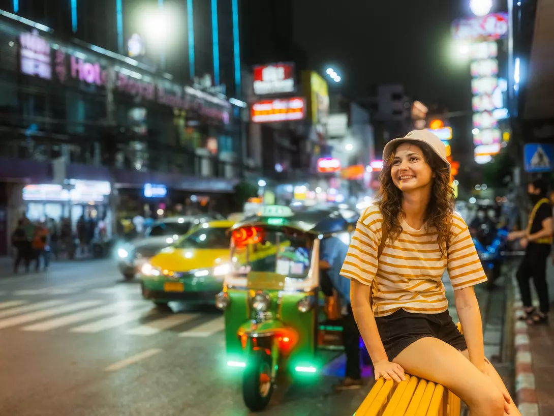 Woman exploring Chinatown in Bangkok at night