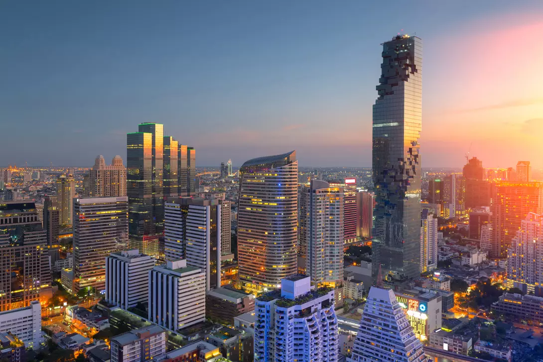 Aerial view of modern office buildings, condominium in Bangkok city downtown,Mahanakorn tower with sunset sky , Bangkok , Thailand