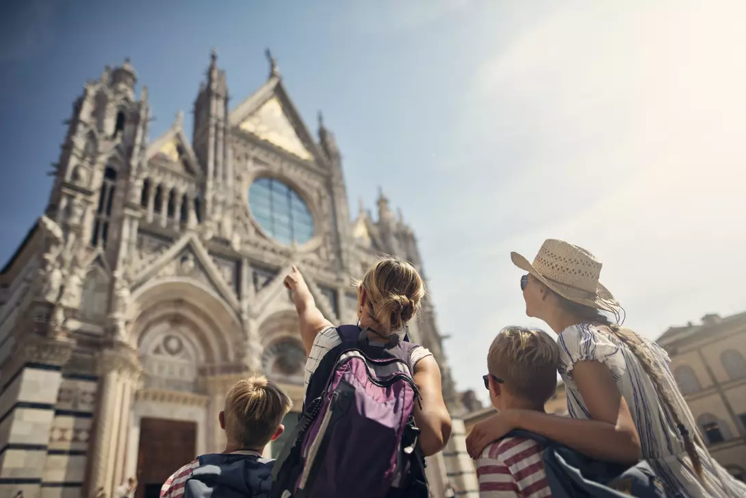family looking at a cathedral in Italy