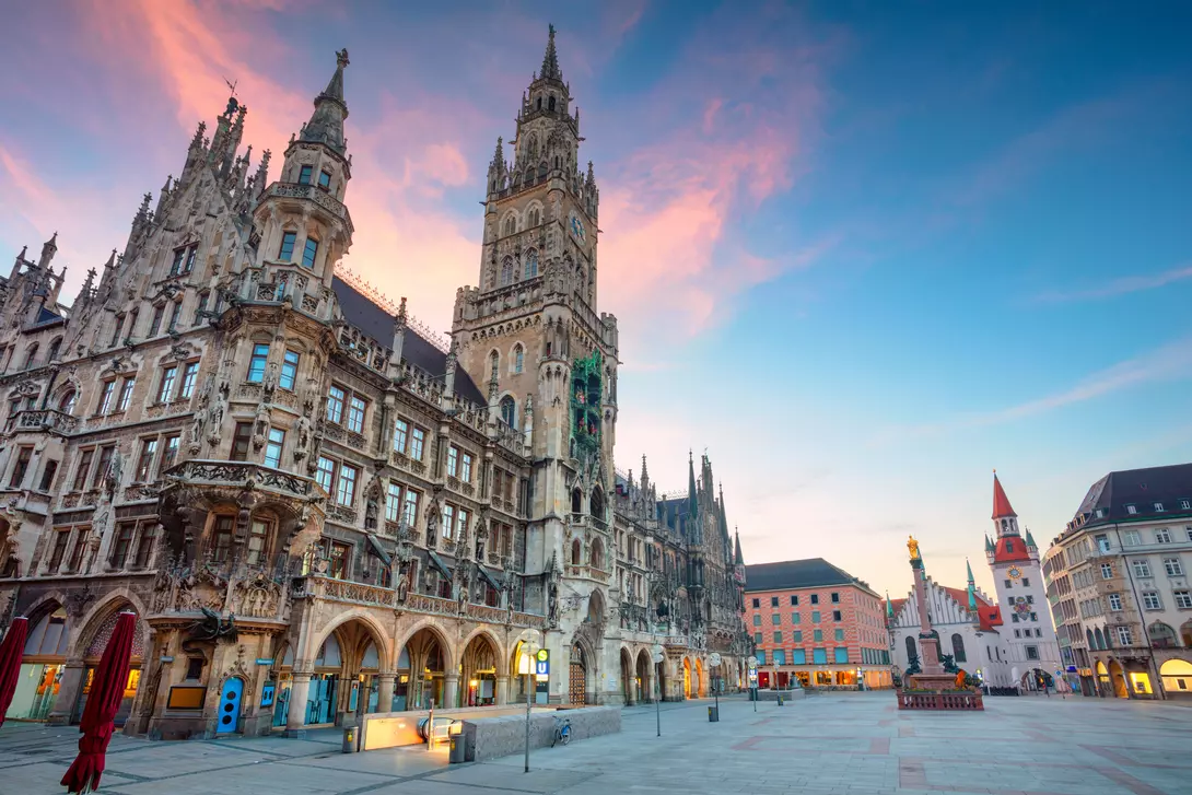 city hall with blue sky and pink clouds in European town