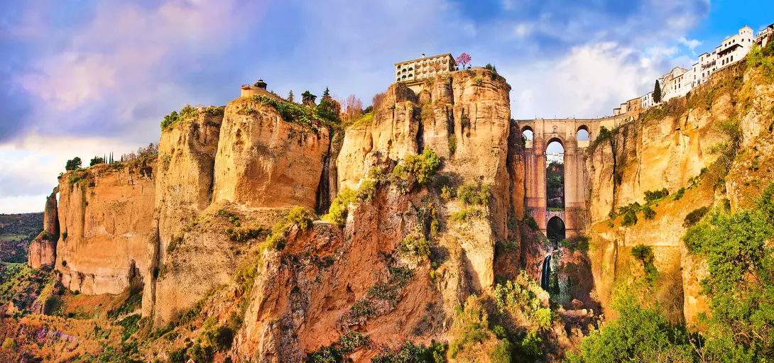 Panoramic view of the old city of Ronda, one of the famous white villages, at sunset in the province of Malaga, Andalusia, Spain