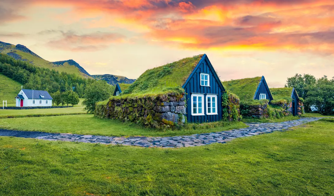 Typical view of turf-top houses in Icelandic countryside.