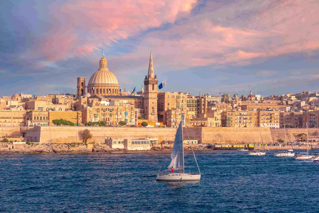 The old town of Valletta with churches of Our Lady of Mount Carmel and St. Paul's Anglican Pro-Cathedral at sunset, Valletta, Malta.