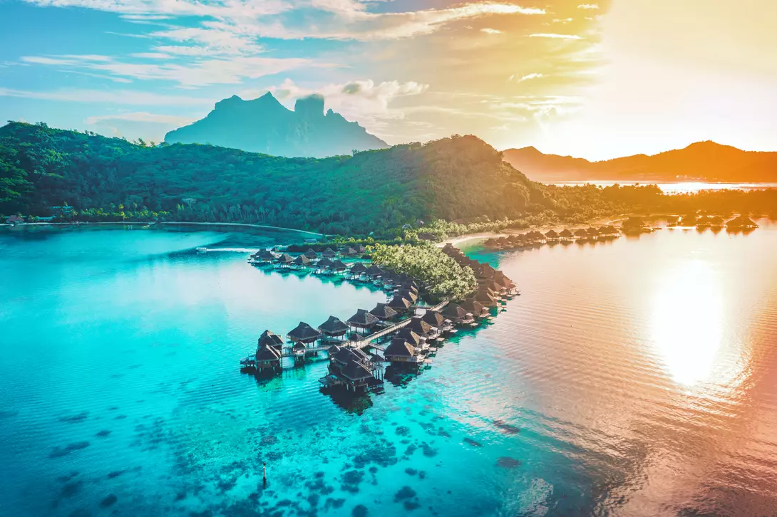 View from above at sunset of Bora Bora overwater bungalows, French Polynesia, Tahiti.