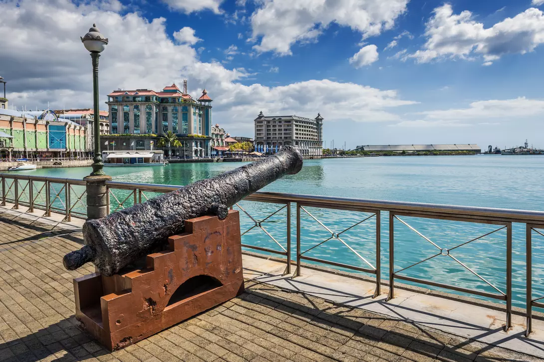 Old cannon on the promenade at Caudan Waterfront, Port Louis, Mauritius.